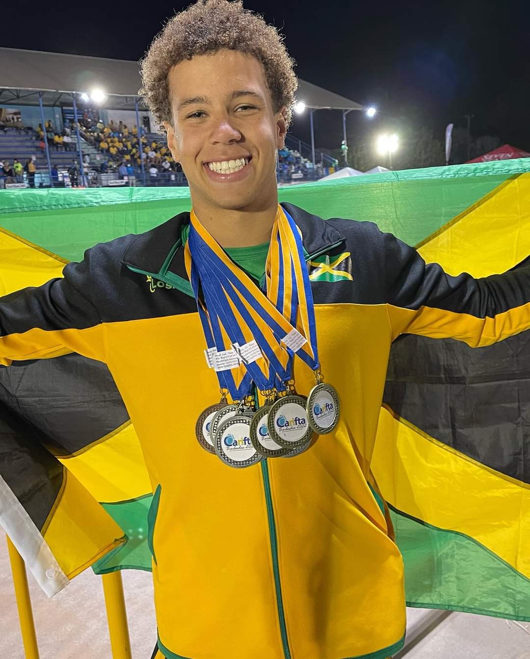 Brady Macpherson-Lewison shows his medals. Photo - Lynval Lowe
